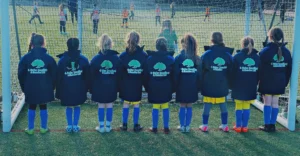 Sporting Khalsa FC Under 8s in their new jackets from 4 Oaks Group